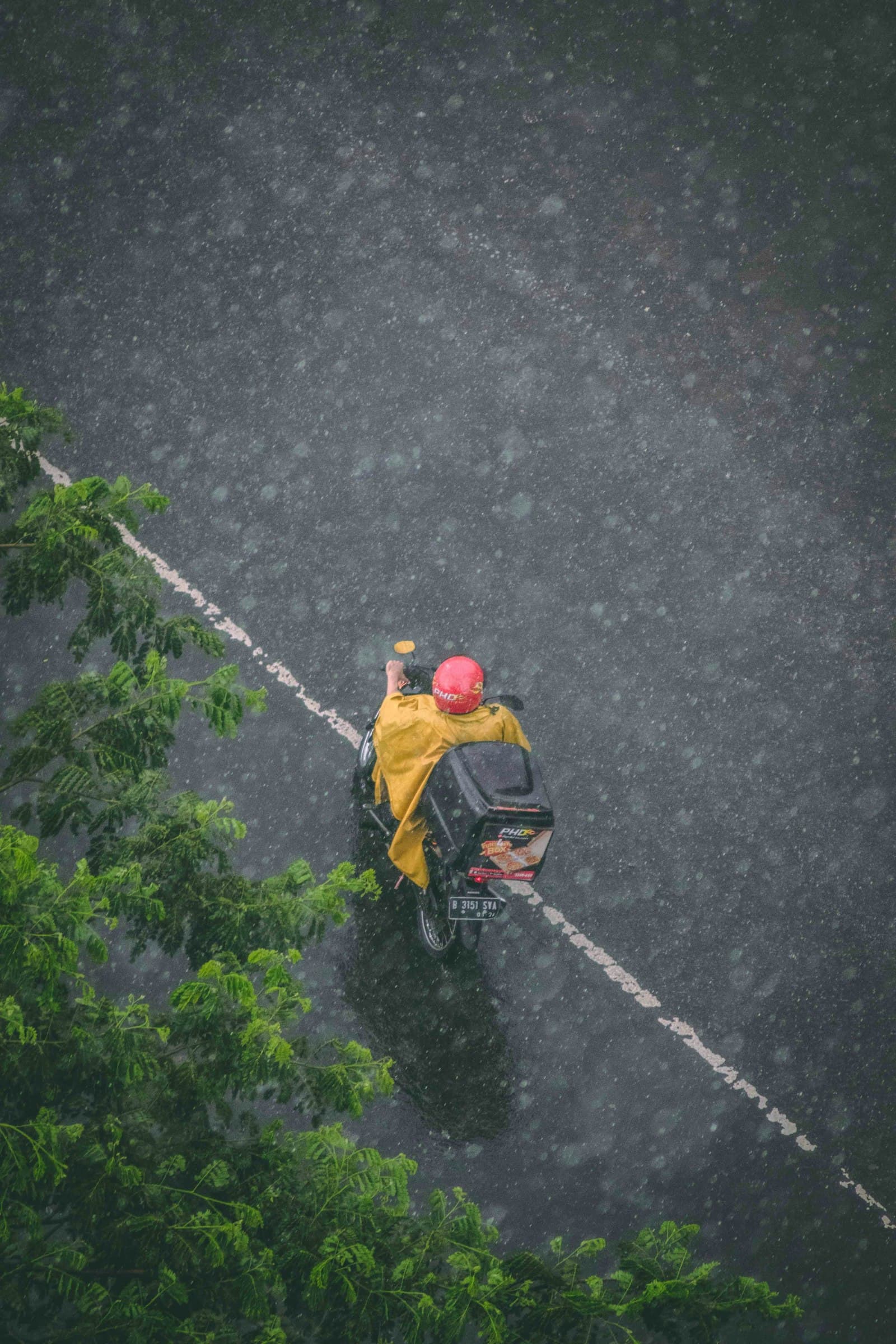 Delivery rider on a motorcycle